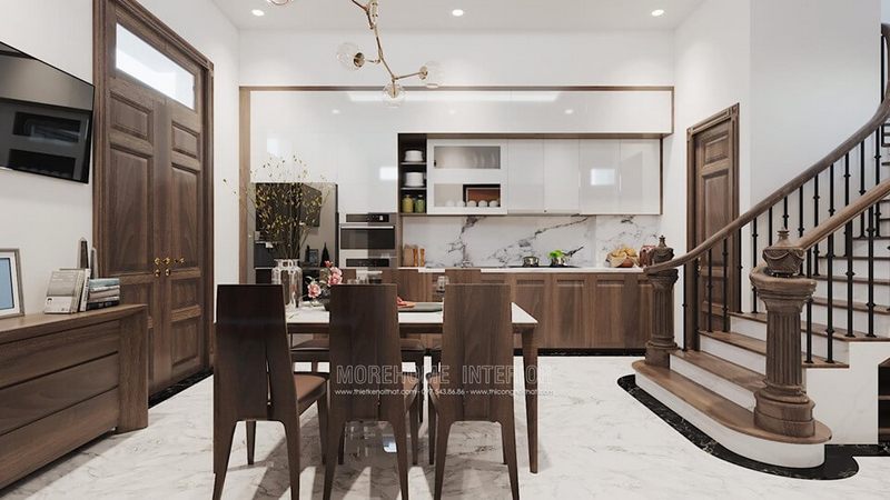 Không gian phòng ăn được trang trí bằng đèn thả trần hiện đại, tạo ra một ánh sáng nhẹ nhàng, làm cho không gian cảm thấy ấm cúng.