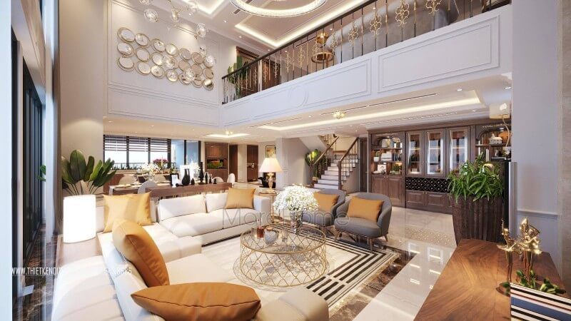 Bộ bàn ghế sofa da cao cấp thiết kế đơn giản với tông trắng kem được lựa chọn với điểm nhấn gối tựa cam đất kết hợp với bàn descor chân inox mạ vàng đẹp thu hút